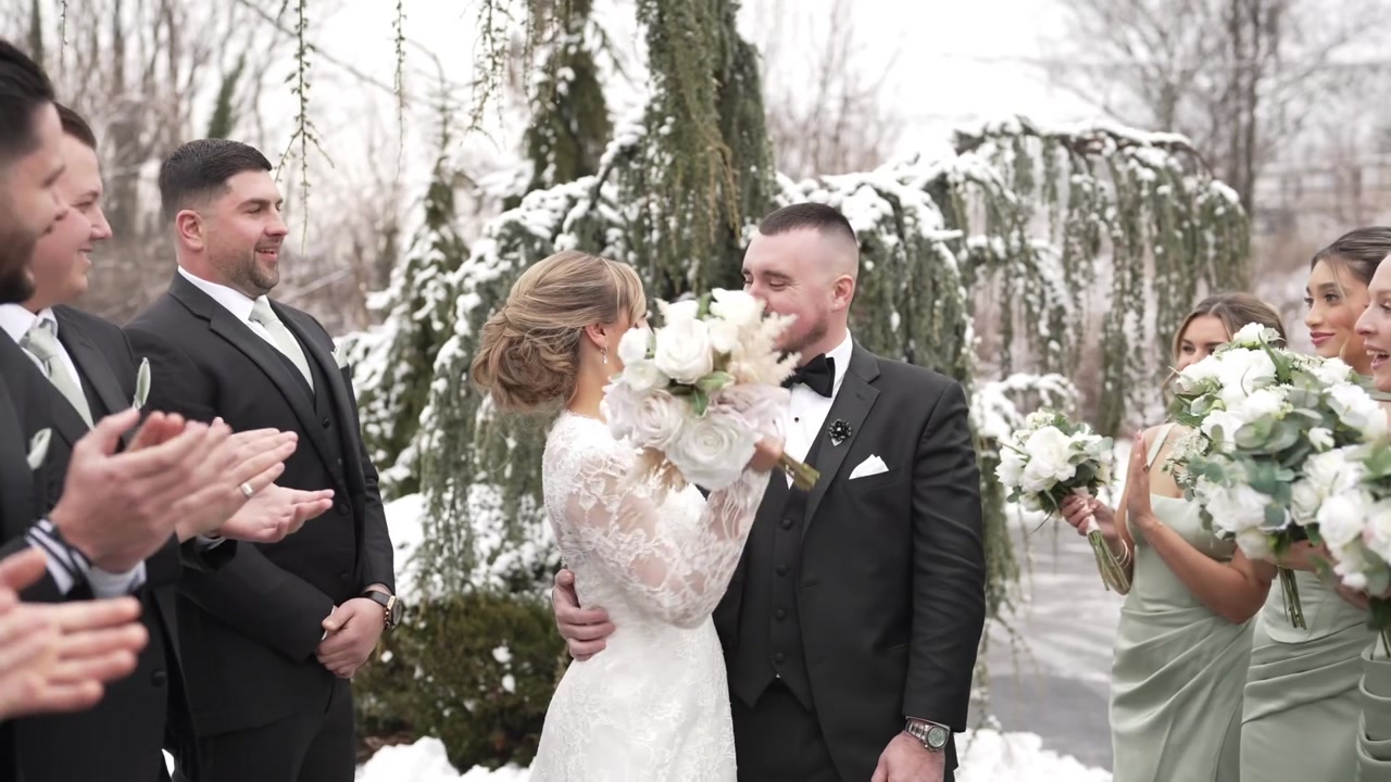 Bride and groom celebrating with their wedding party